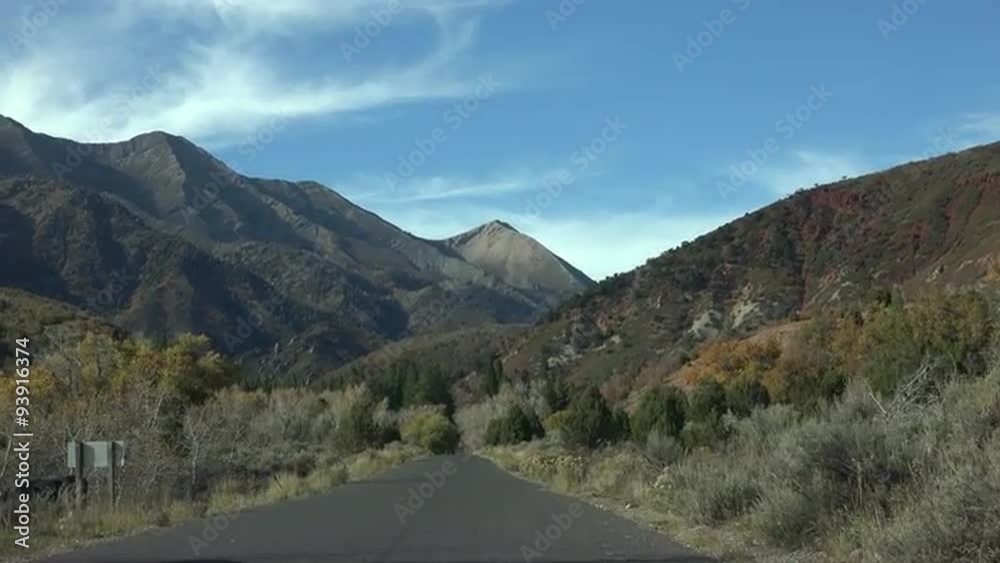 Driving open cattle range mountain road 4K 044