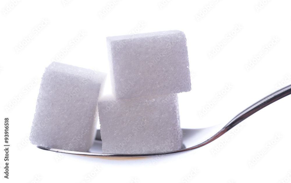 Obraz premium White sugar cubes on a spoon
