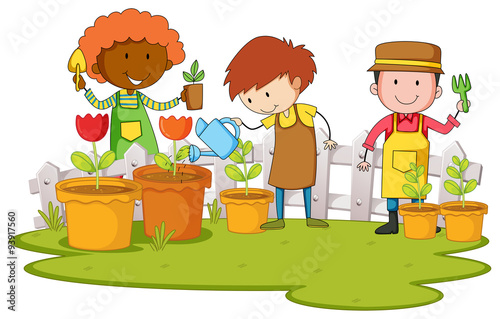 Gardeners planting tree and flower in garden