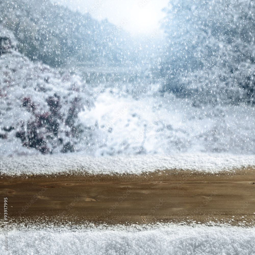 Fototapeta premium wooden desk space and snow 