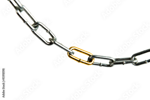 golden link in a steel chain