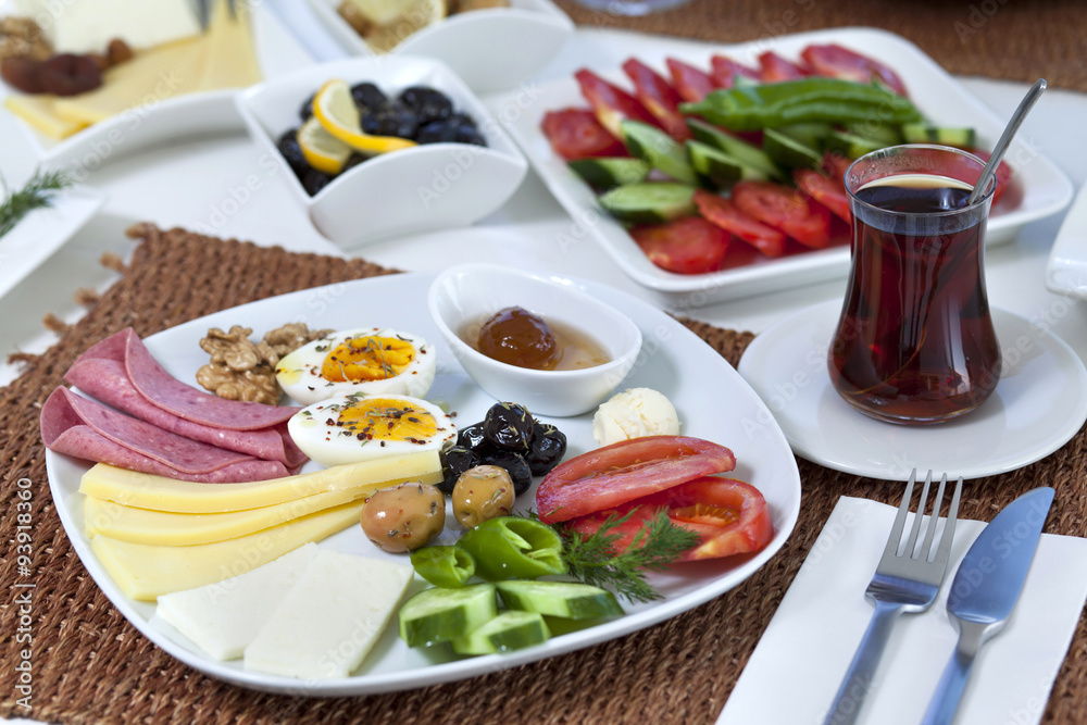 Rich and delicious Turkish breakfast on white wood table Rich and delicious Turkish breakfast on white wood table