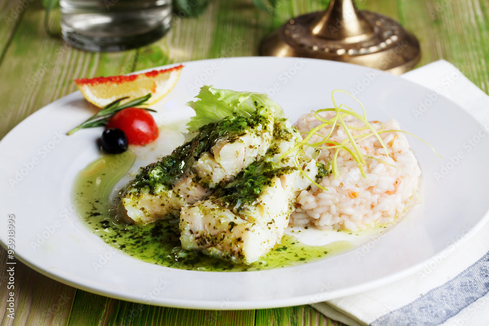 white fish with pesto sauce and meat plate in a still life white fish with pesto sauce and meat plate in a still life