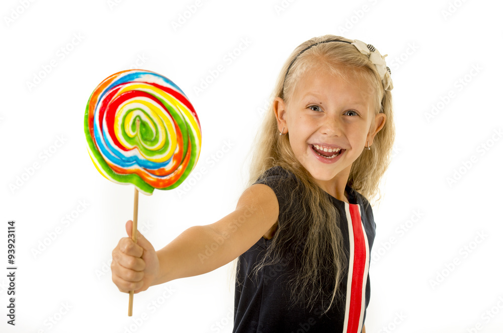 beautiful little female child with sweet blue eyes holding huge lollipop spiral candy smiling happy