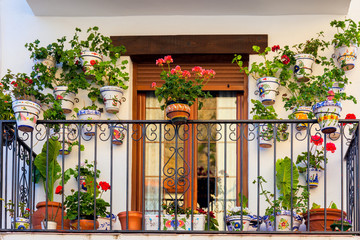 Traditional European Balcony with colorful flowers and