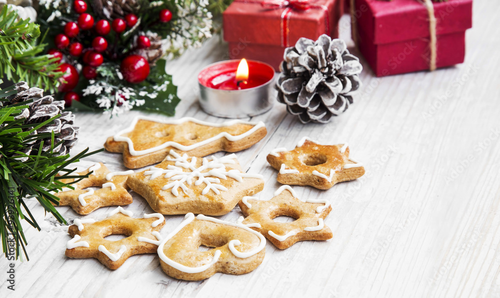 Fototapeta premium Christmas Gingerbread Cookies with Ornaments on Wooden Board