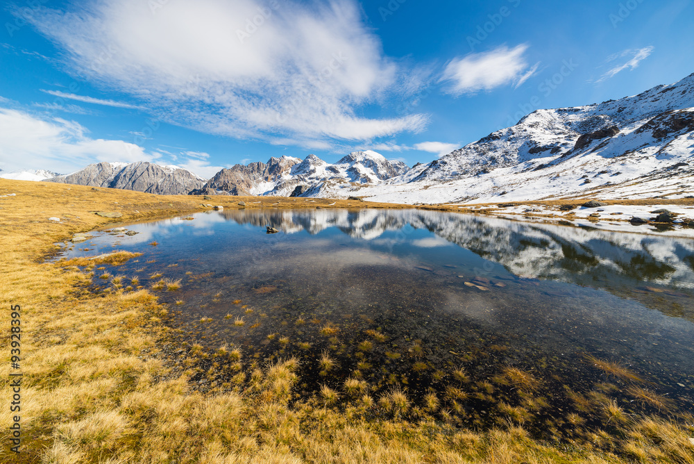 High altitude blue alpine lake in autumn season