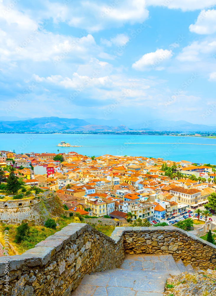 Aerial view of Nafplio city on Greece coast from castle on hill in summertime