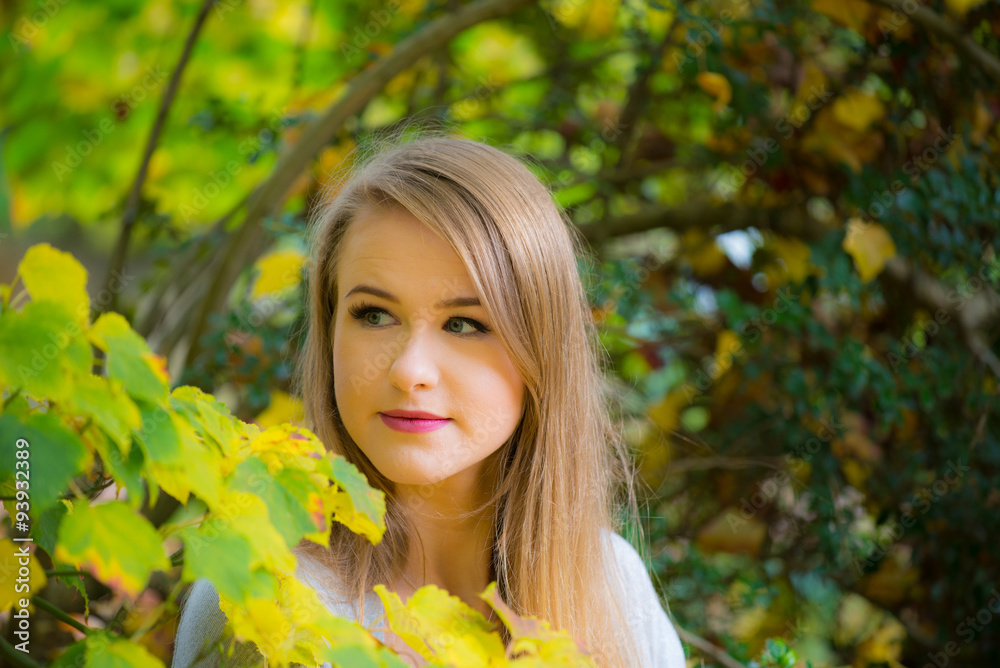 Young woman in autumnal trees. Young woman in autumnal trees.