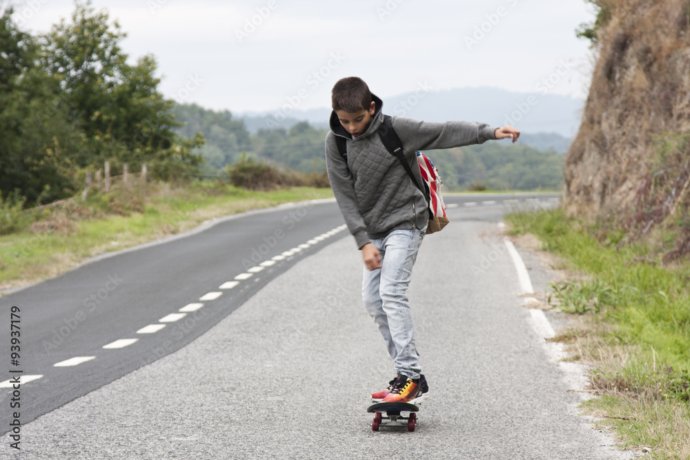 child with skateboard outdoors