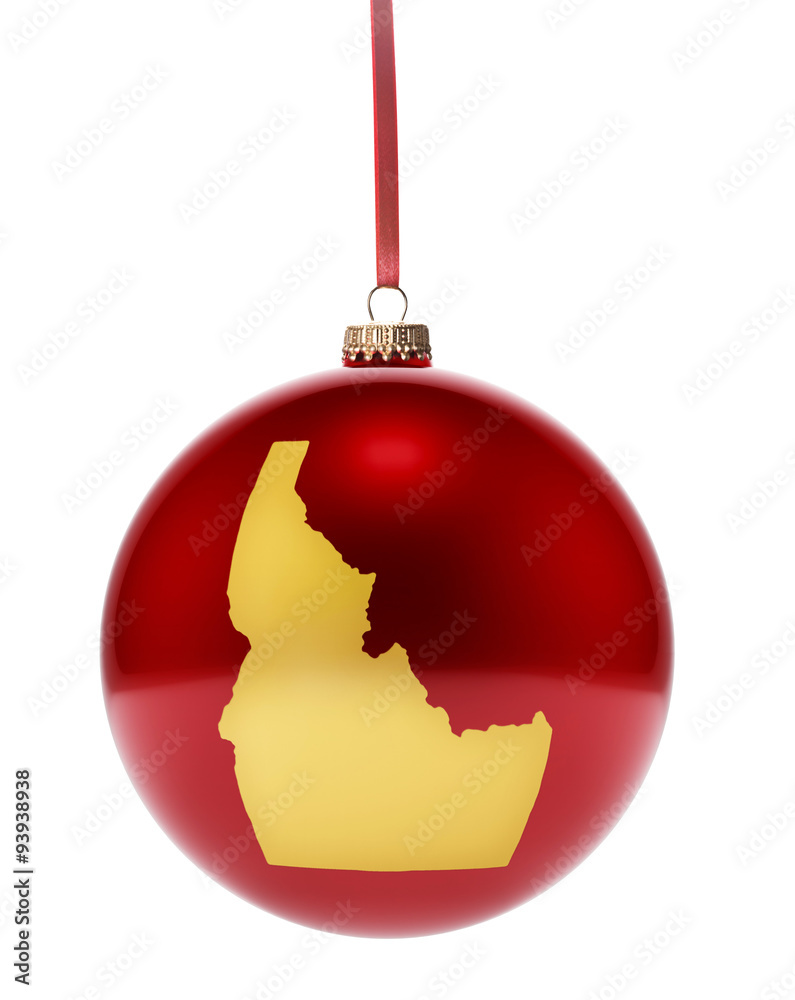 Red bauble with the golden shape of Idaho.(series) Red bauble with the golden shape of Idaho.(series)