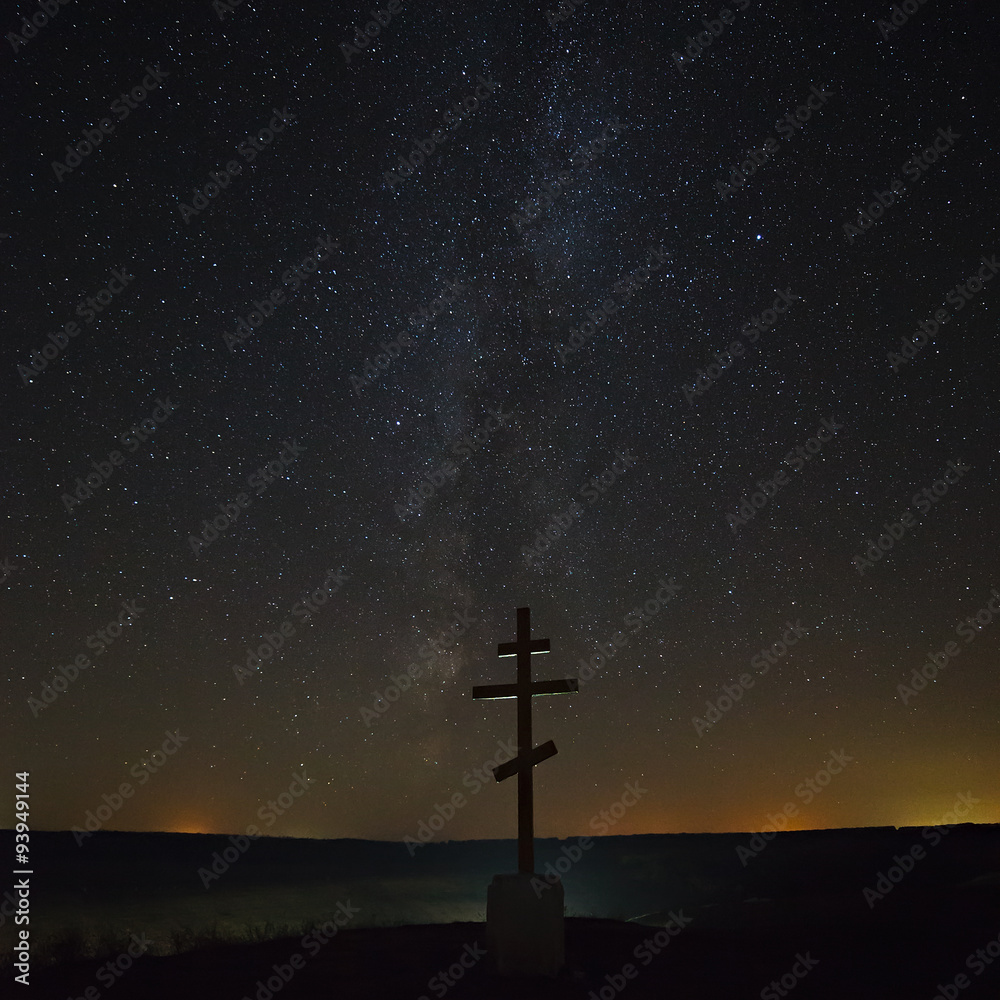 The cross on the background of the Milky Way in the night sky.
