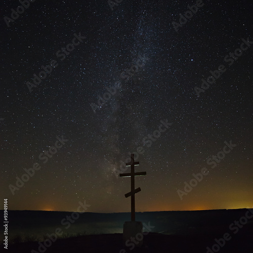 The cross on the background of the Milky Way in the night sky.