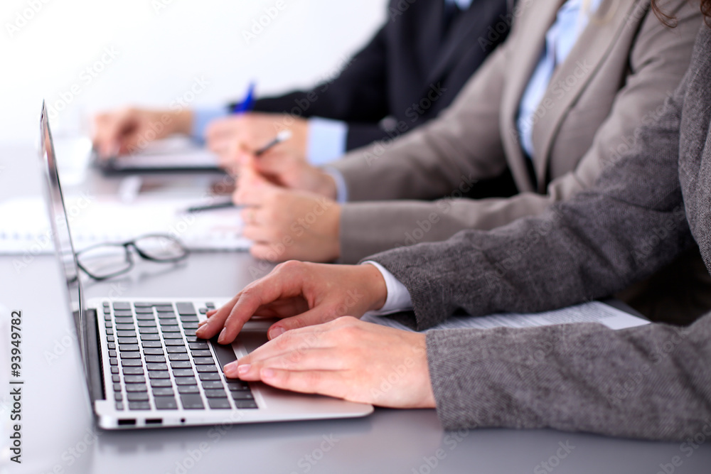 Group of business people sitting at the table and working Group of business people sitting at the table and working