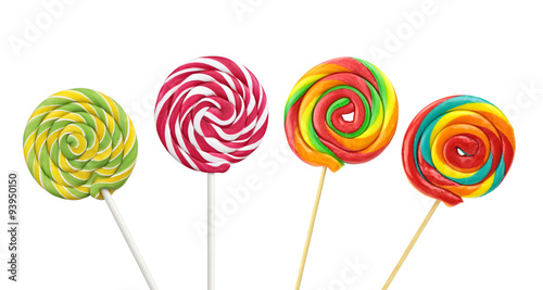 Colorful spiral lollipops on white background