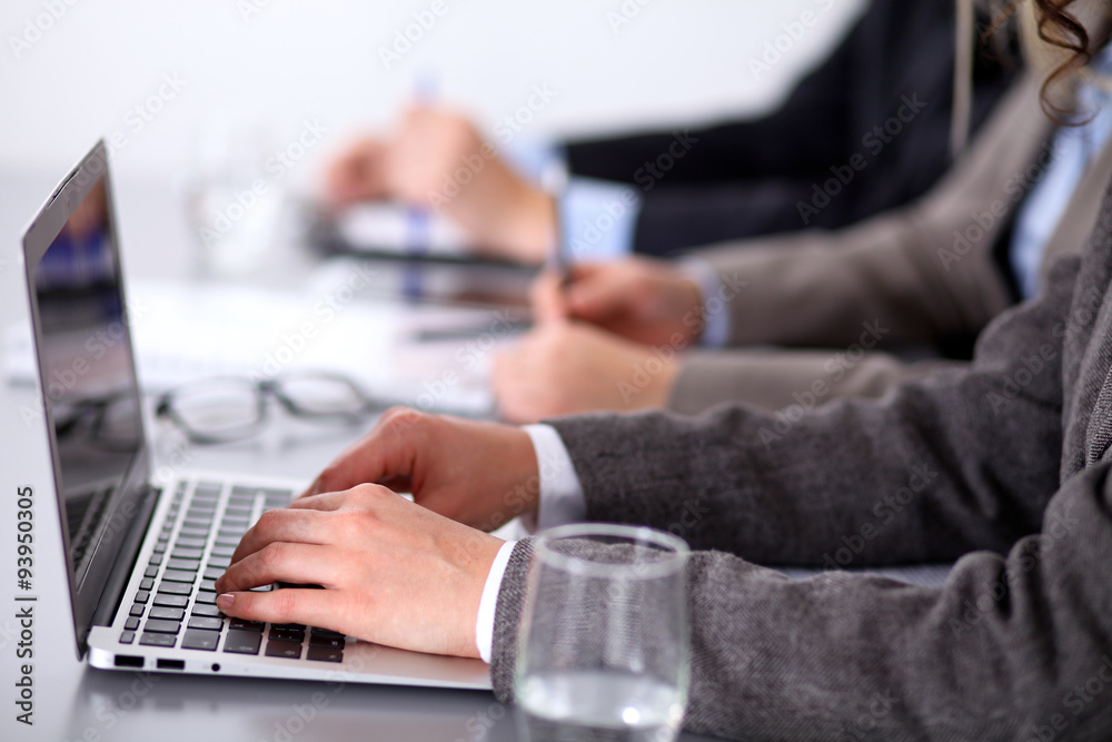 Group of business people sitting at the table and working Group of business people sitting at the table and working