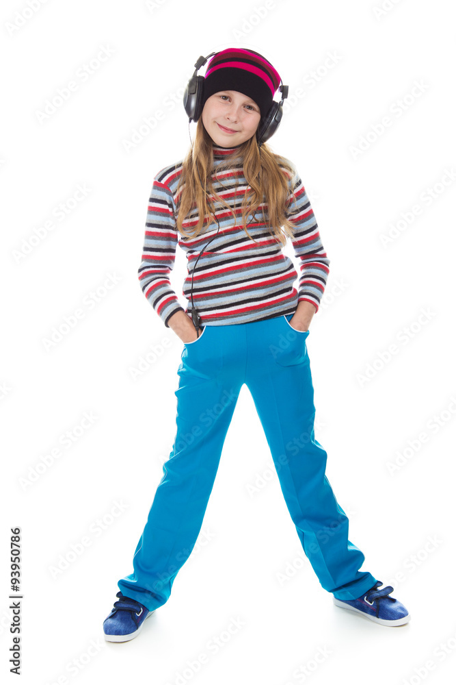 The girl in headphones dancing to the music. The girl in headphones dancing to the music.