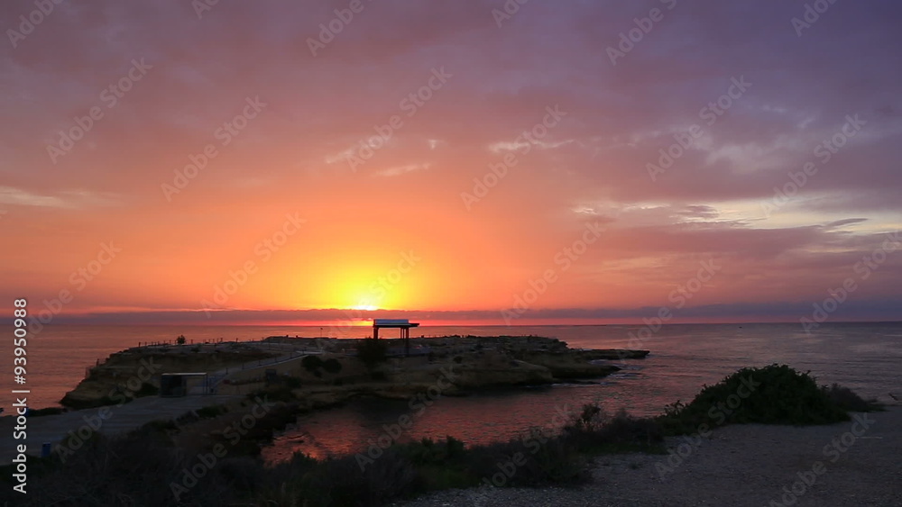 morning and a beautiful orange-pink-purple sunrise and the sun rises at dawn from the sea and sky with clouds painted in unusual juicy bright colors morning and a beautiful orange-pink-purple sunrise and the sun rises at dawn from the sea and sky with clouds painted in unusual juicy bright colors