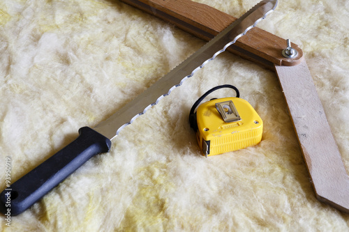 Mineral wool THERMAL INSULATION with meter, knife and protractor