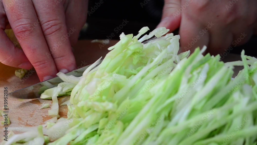 The cook cuts cabbage The cook cuts cabbage
