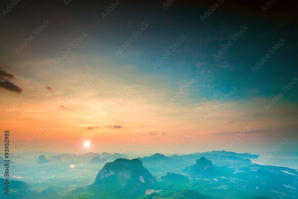 mountains under colorful sky in sunset