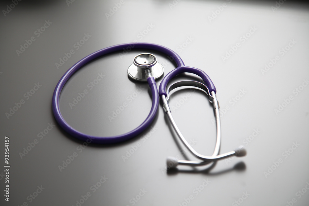 Stethoscope on the grey desk, close up Stethoscope on the grey desk, close up