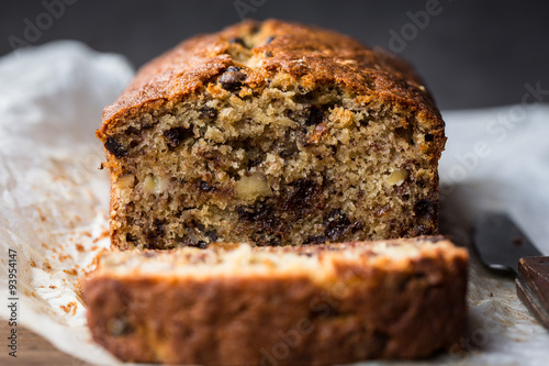 A fresh homemade loaf of banana walnut and chocolate chips bread photo