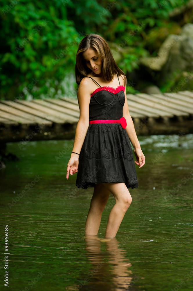 Beautiful young woman relaxing in a lake forest Beautiful young woman relaxing in a lake forest