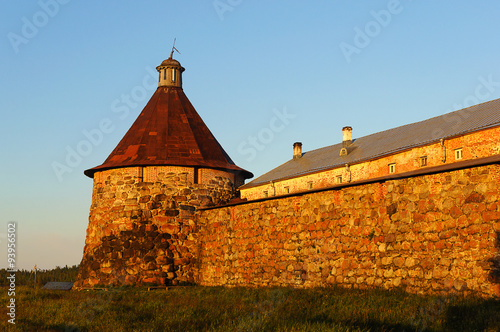 Walls and towers of the Solovetsky monastery at sunset