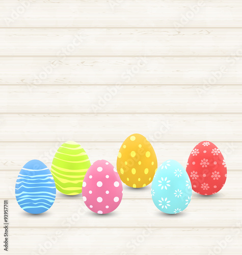 wooden background with colorful traditional eggs for Easter