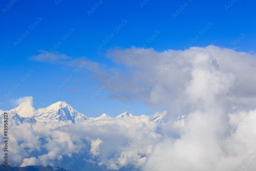 beautiful rolling clouds and snow mountain landscape