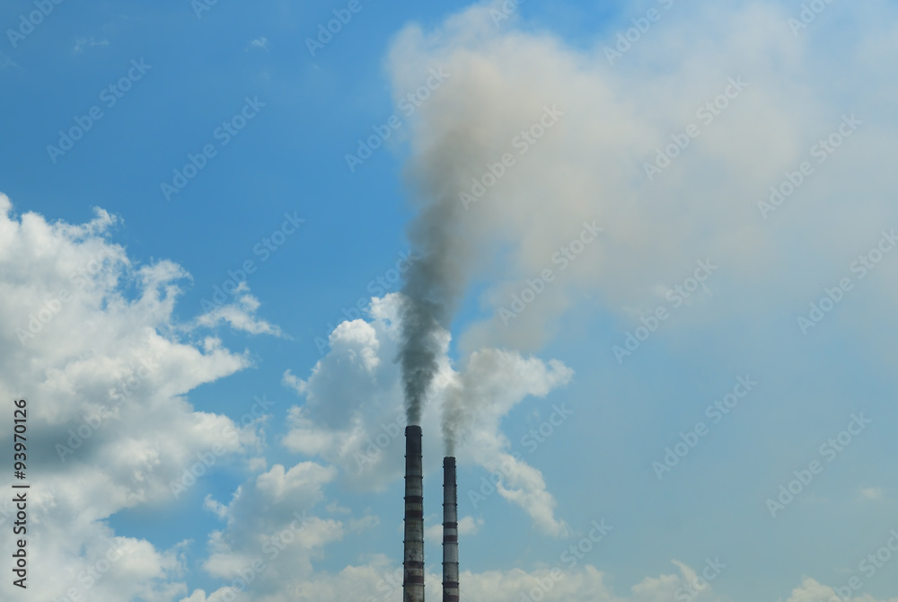 smoke from the pipes against the blue sky