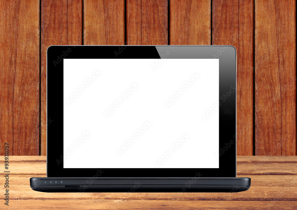 Black laptop on wooden table Black laptop on wooden table