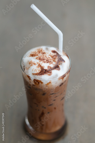 iced cocoa in a glass on wood background