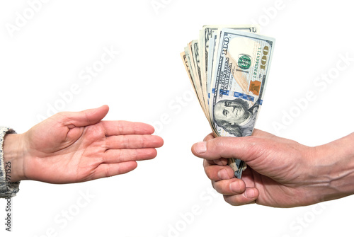 Close-up Hand giving  Us Dollars isolated on white