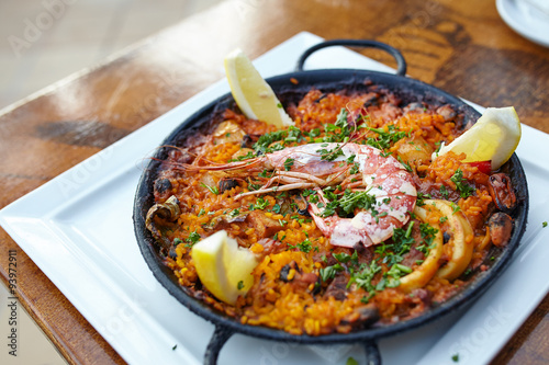 Seafood paella in the fry pan with copy space