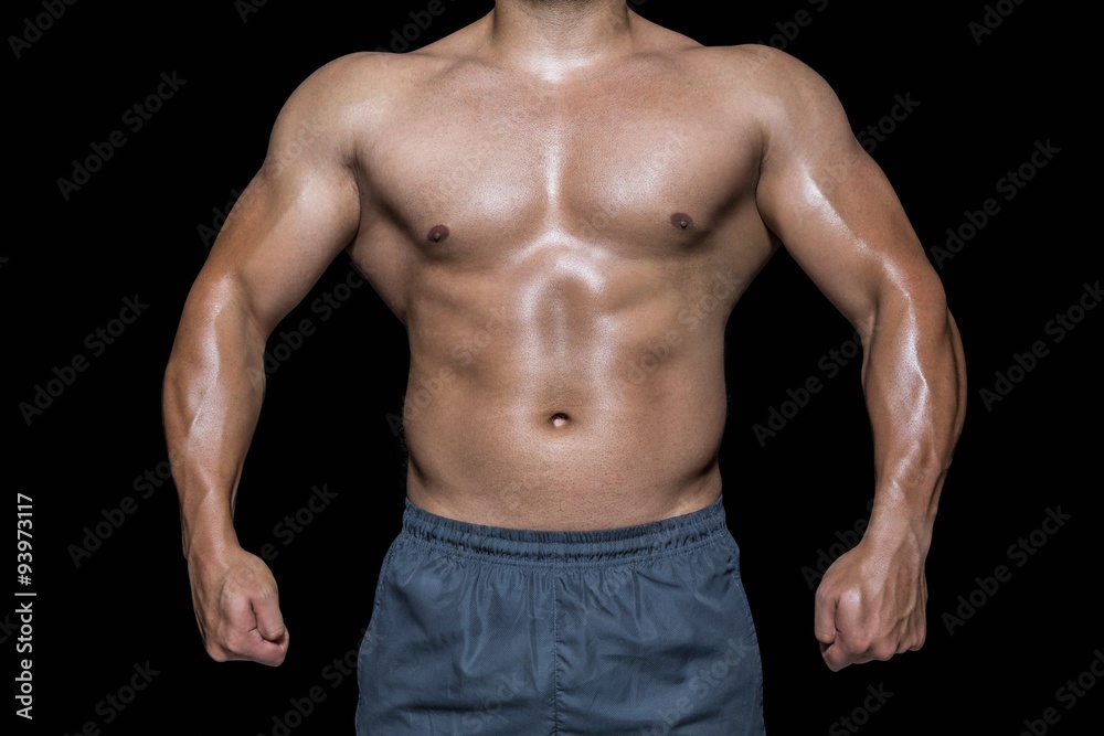 Mid section of a bodybuilder man