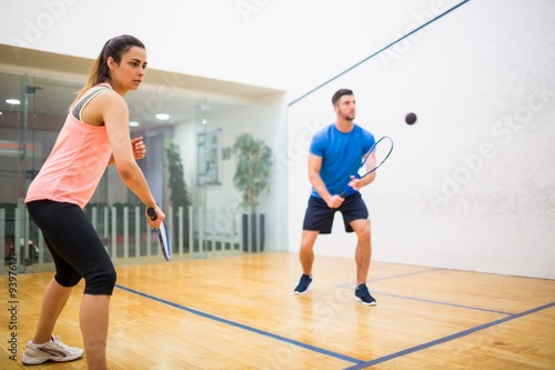 Couple play some squash together © WavebreakmediaMicro