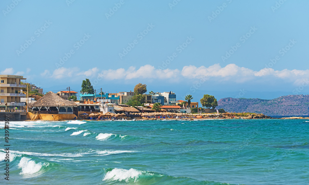 Panoramic view of the city and beach with people.