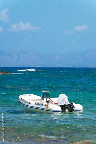 Inflatable motor boat on sea. Space for your text. © M-Production
