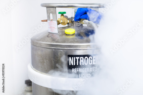 Huge tank of nitrogen half covered by fume caused by evaporation photo