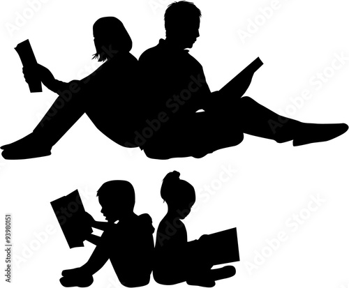 Silhouette of a family reading a book.