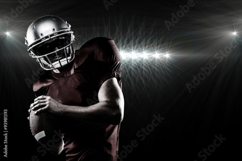Composite image of american football player in looking away photo