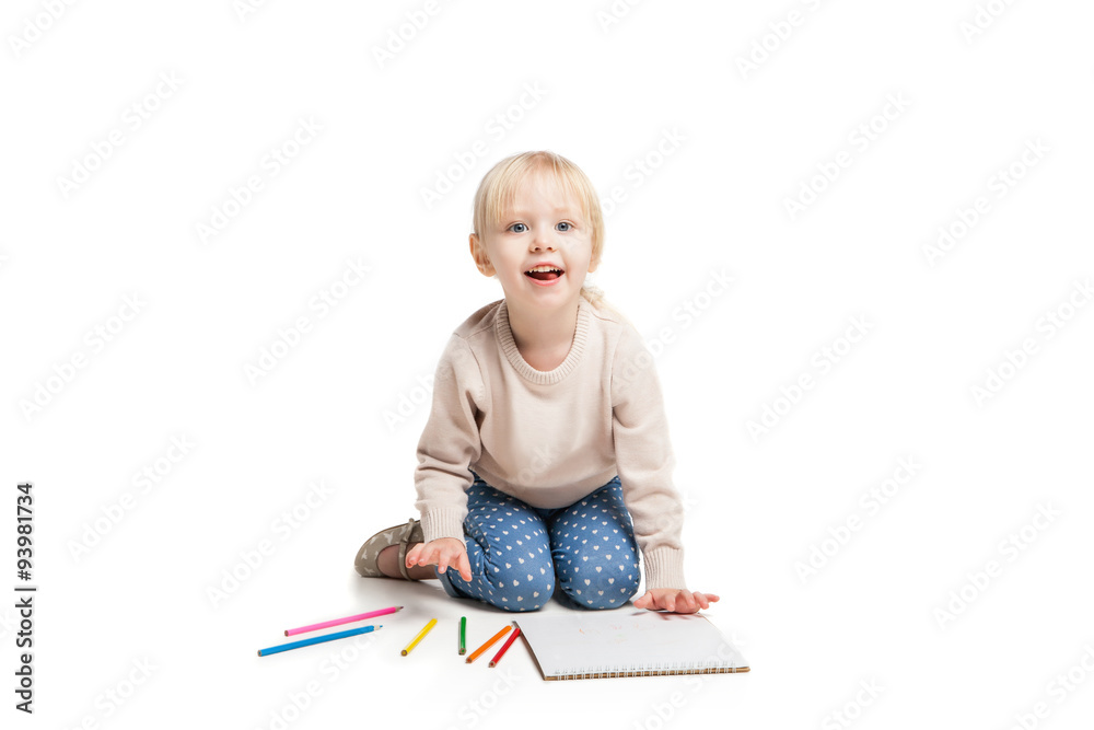 Little cute girl sitting on floor and drawing with colourful Little cute girl sitting on floor and drawing with colourful
