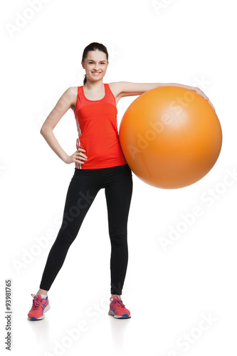 Beautiful sport woman doing fitness exercise on ball 
