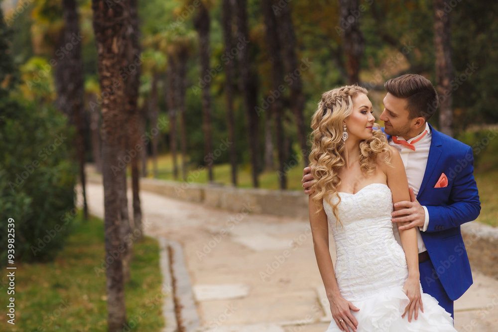 Beautiful wedding couple, happy bride and groom in nature.
