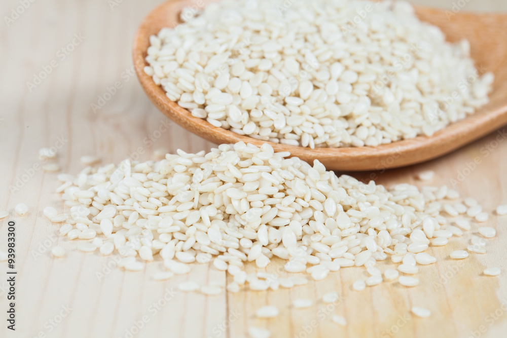 Sesame seeds in wood cup Sesame seeds in wood cup