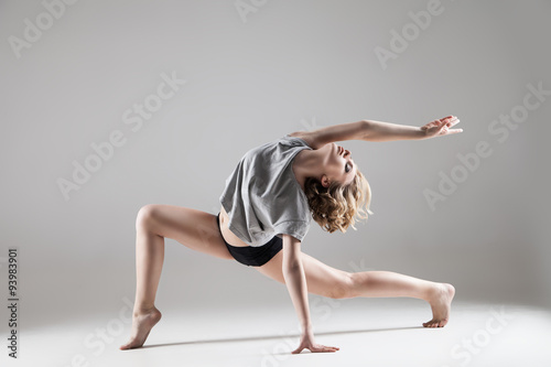 Wallpaper Mural young beautiful woman in grey T-shirt and black shorts dancing Torontodigital.ca