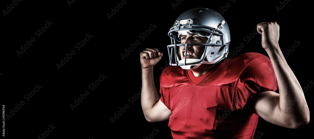 Composite image of happy sportsman cheering with clenched fist Composite image of happy sportsman cheering with clenched fist