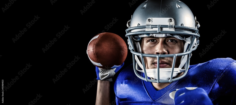 Composite image of close-up portrait of sportsman holding ball Composite image of close-up portrait of sportsman holding ball